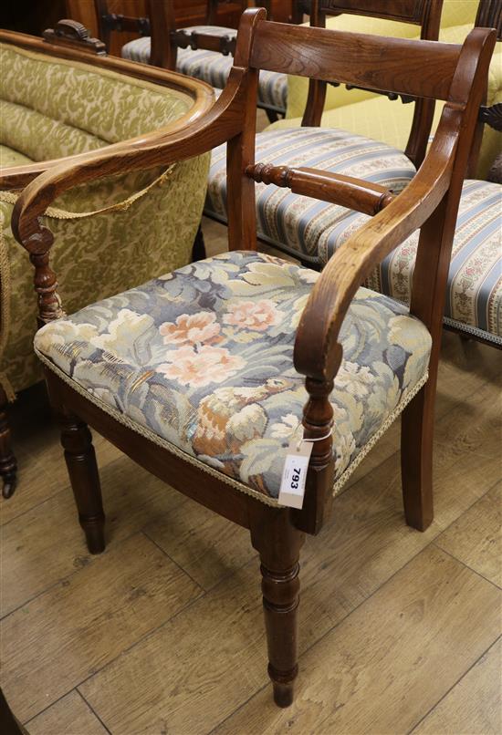 A Regency elm scroll armchair